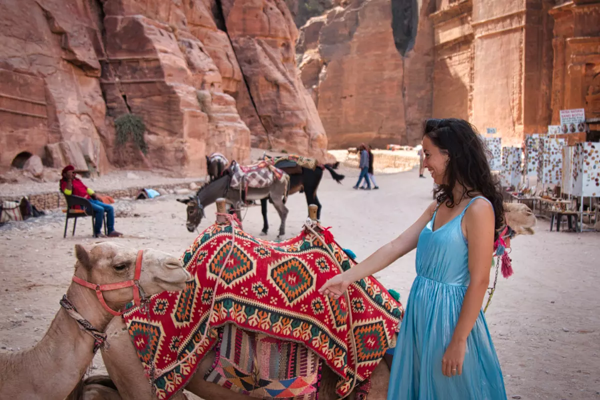 woman with camels in petra