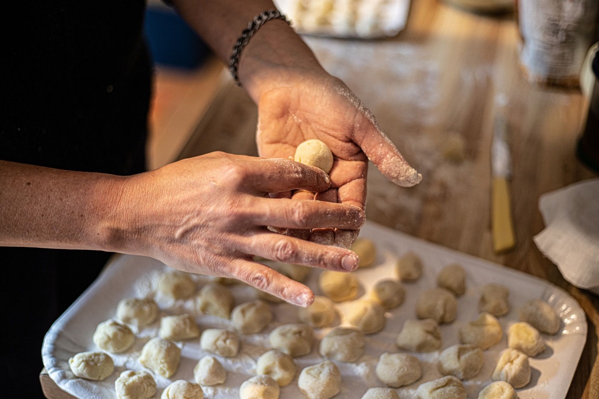 Woman making gnocchi - italian food