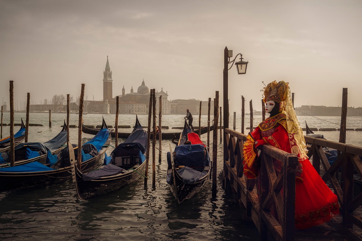 mask in front of gondola in venice puns venice quotes venice intagram captions