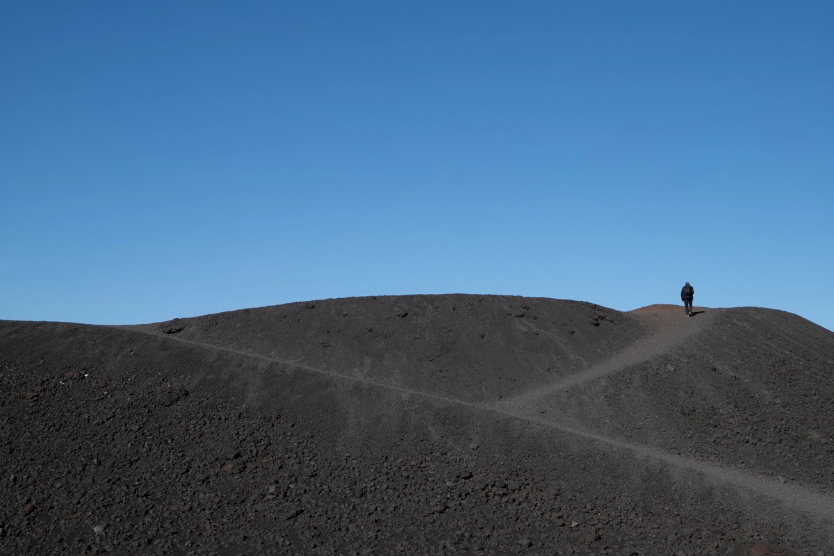 walking on the black lava dunes of mount etna